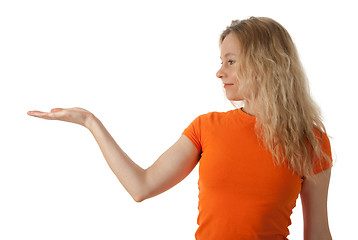 Image showing Nice young woman holding her hand palm up