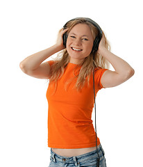 Image showing Smiling girl listening to music in headphones