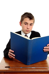 Image showing Student reading a text book