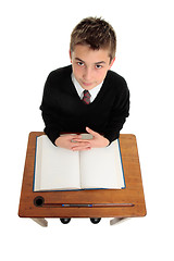 Image showing School boy sitting at school desk