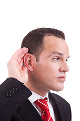 Image showing businessman, listening, viewing the  gesture of hand behind the ear