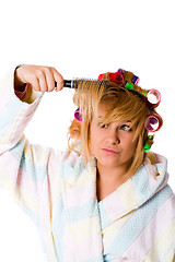 Image showing housewife with hairbrush