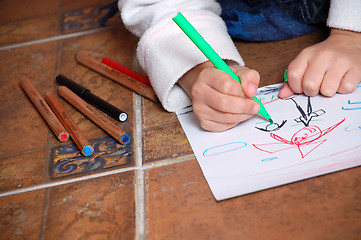 Image showing child drawing people