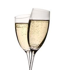 Image showing Two champagne glasses in toast