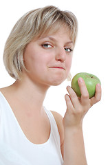 Image showing isolated beautiful blond girl with an apple