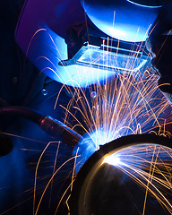 Image showing Blue lit MIG welder close