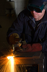 Image showing Close up of welder with orange sparks