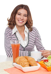 Image showing Woman smiling having breakfast