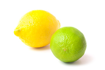 Image showing Close up of fresh green lime and lemon isolated on white