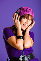 Image showing Beautiful woman listening music