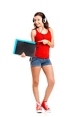 Image showing Young girl listen music