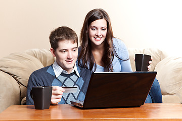 Image showing Happy couple shopping online