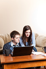 Image showing Couple paying bills by online banking