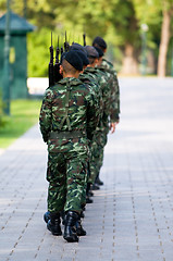 Image showing Soldiers in camouflage marching