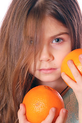 Image showing child with oranges