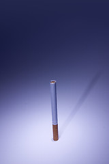 Image showing Isolated Cigarette Under Blue Light