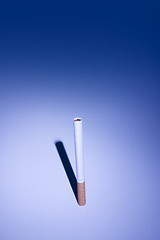 Image showing Isolated Cigarette Under Blue Light