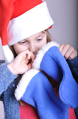 Image showing child looking for a Christmas present