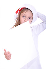 Image showing Funny face of child wearing red Santa’s hubcap