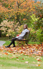 Image showing Girl on small bench