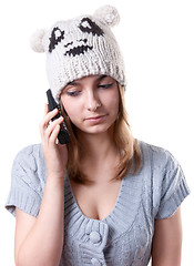 Image showing Beautiful girl in winter hat with telephone