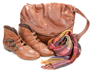 Image showing Brown leather bag, scarf and pair feminine boots