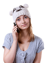 Image showing Beautiful girl in winter hat with telephone