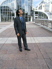 Image showing Businessman looking up