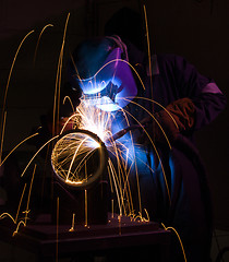 Image showing MIG welding steel pipe