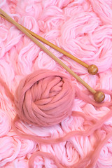 Image showing Sphere of pink wool with needles