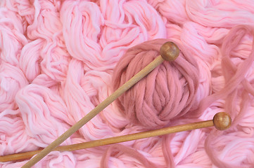 Image showing Sphere of pink wool with needles