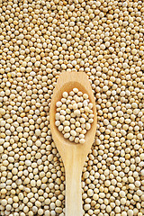 Image showing Wooden spoon and dried soybeans