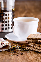 Image showing cup of herbal tea and some fresh cookies 