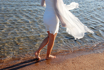 Image showing Walking by sea on sand