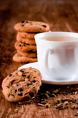 Image showing cup of herbal tea and some fresh cookies