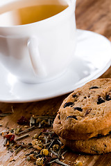 Image showing cup of herbal tea and some fresh cookies