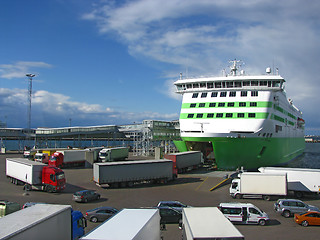 Image showing Trucks boarding ferry