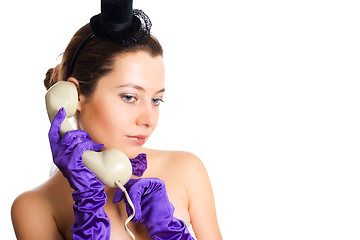 Image showing woman in corset and little hat talking on the phone