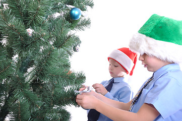 Image showing boys decorating a Christmas tree