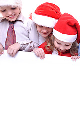 Image showing Christmas children with a banner