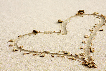 Image showing hearts drawn in the sand with seafoam and wave