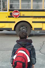 Image showing a toddler waiting to catch the school bus