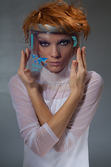 Image showing Beautiful woman with navigation display embedded in her mask