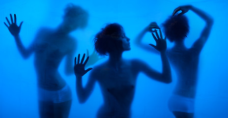 Image showing Moving and dancing silhouettes of women