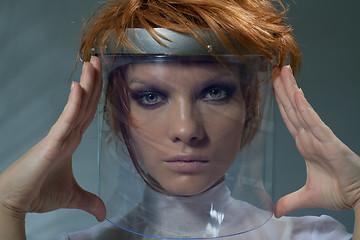 Image showing Serious clever woman in glass mask