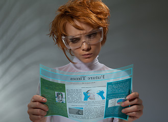 Image showing Beautiful woman with flexible hi-tech display