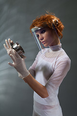 Image showing Scientist woman examine metal part concept