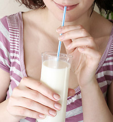 Image showing Young people eating milk with cereals