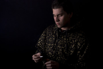 Image showing portrait of a young man with cigarette 