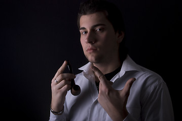 Image showing portrait of a young man with pipe 